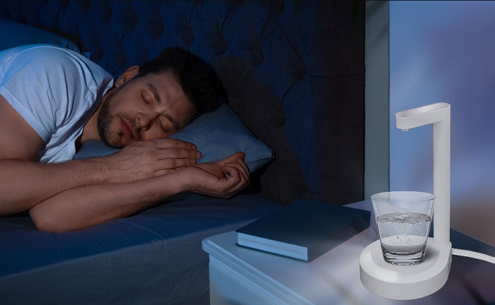 A bedside table lamp with water dispenser