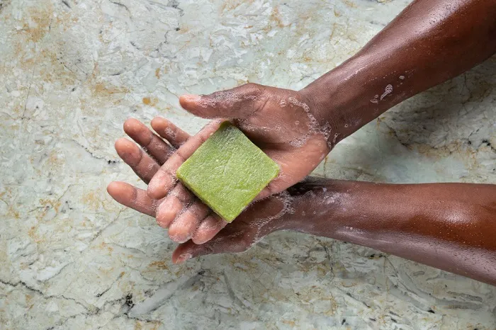 A soap bar press