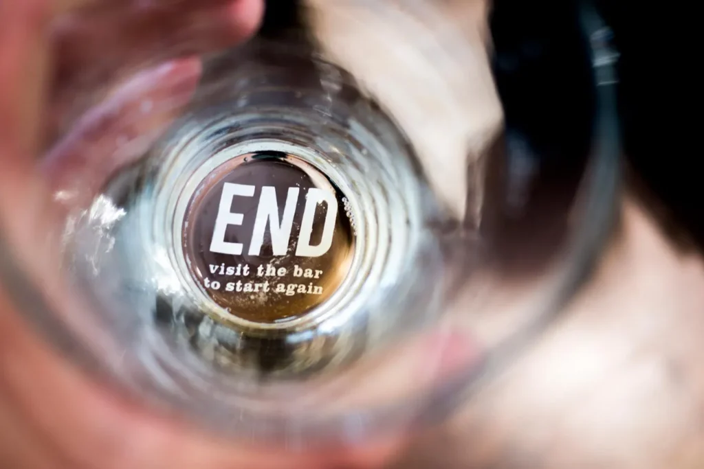Ads on inside base of beer glasses