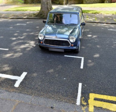 Have different sized parking spaces (smaller=cheaper) to encourage people to buy smaller cars